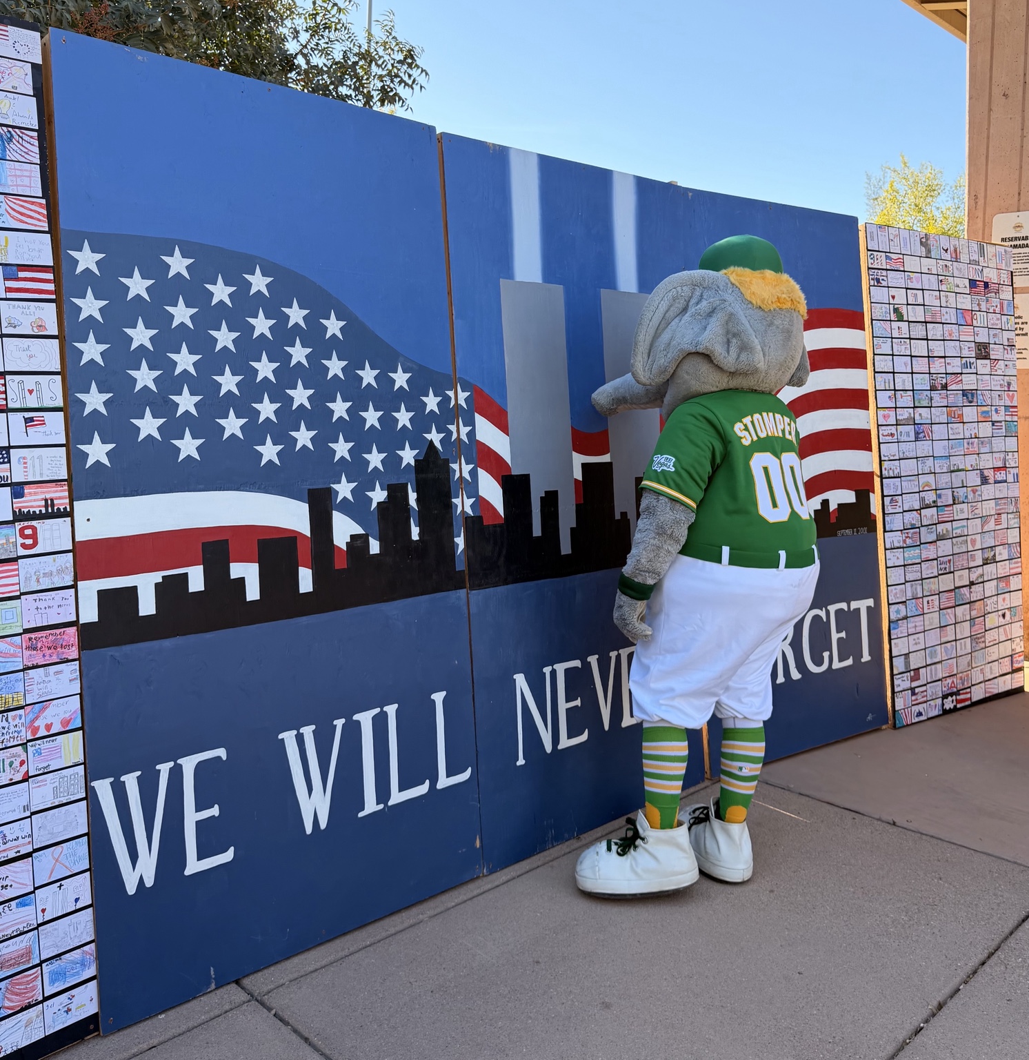 Stomper viewing handwritten CCSD student cards on the Las Vegas 9/11 Remembrance Wall